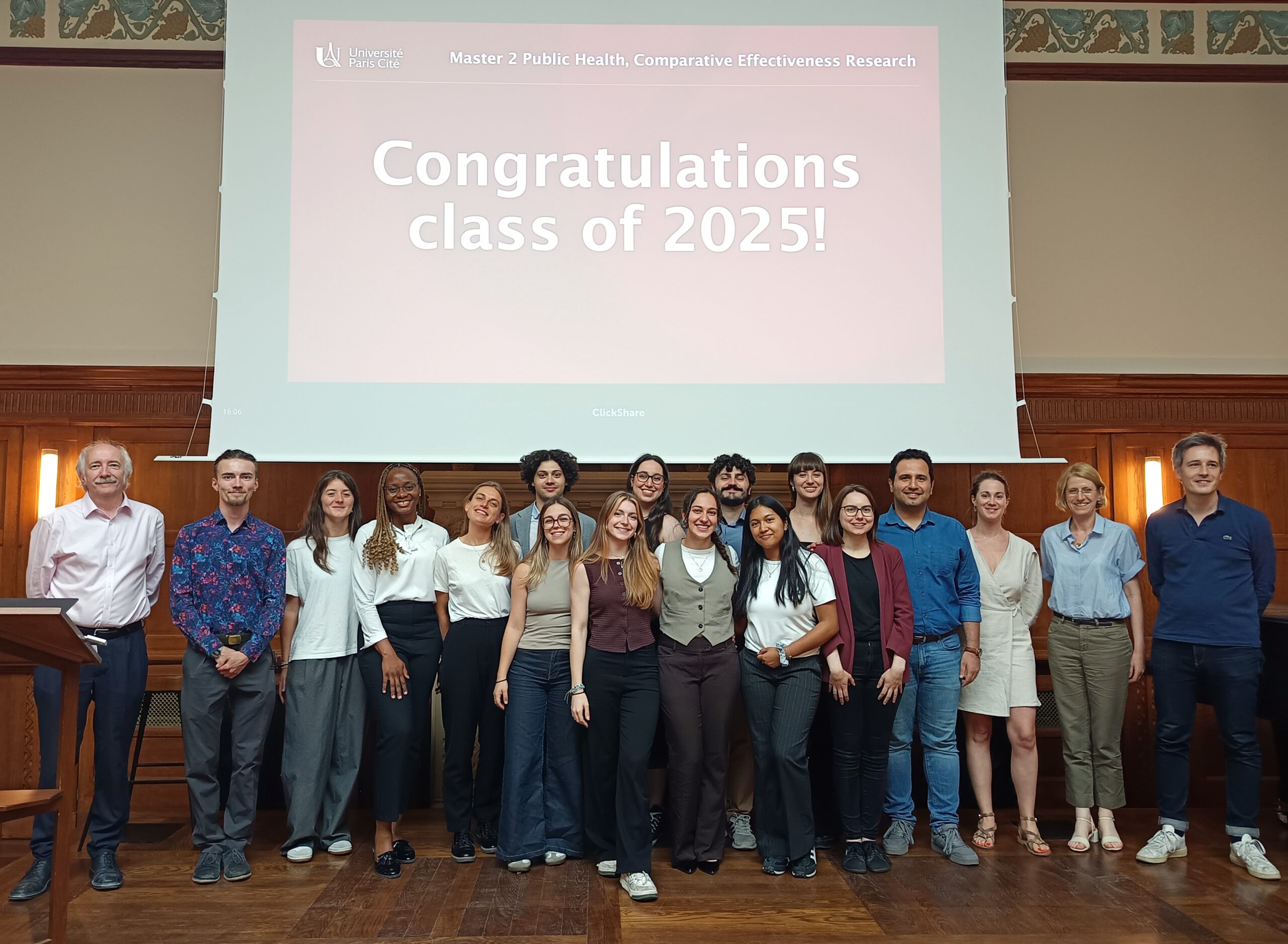Group of students with their professors celebrating